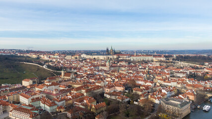 Fototapeta na wymiar Aerial view of River and buildings in Old Town of Prague, Czech Republic. Drone photo high angle view of City