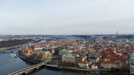 Fototapeta premium Aerial view of River and buildings in Old Town of Prague, Czech Republic. Drone photo high angle view of City