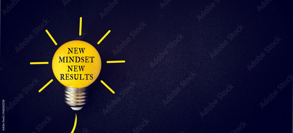 Poster light bulb with the text new mindset in front of black background