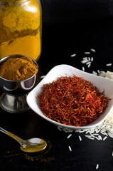 Macro Image of Fresh Saffron, Turmeric and White Rice with Dark Background