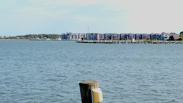 Right To Left Pan of Ocean Town To Reveal a Small Light House
