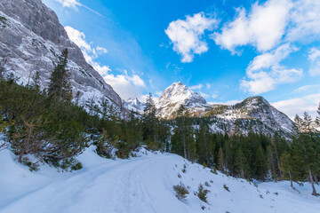 Fototapeta premium Snow-covered mountain range with a majestic massif during winter in Ehrwald, Tyrol, Austria