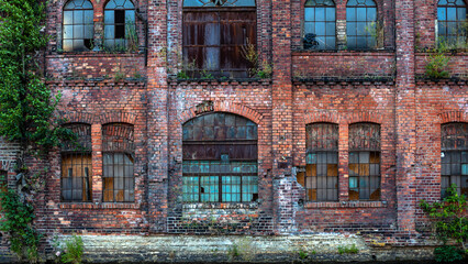 The old brick grunge wall of closed factory