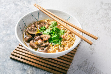 Asian vegan miso ramen noodle soup with mushrooms, onions and cilantro