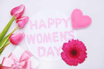 Gerbera and tulips flowers, felt heart, gift and roundcard with text 8 Happy Women's Day on white background