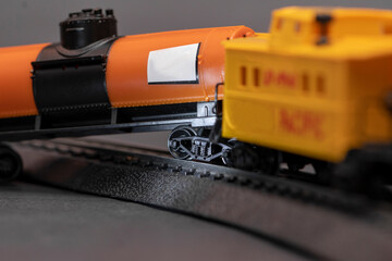 Toy railway tank derailed, close-up. Concept: train wreck, train crash and accident.