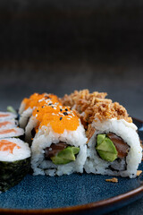 Sushi roll sushi with shrimp, avocado, red caviar , sesame. Sushi menu. Japanese food