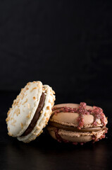 Close-up of Delicious Chocolate Macarons on Dark Background