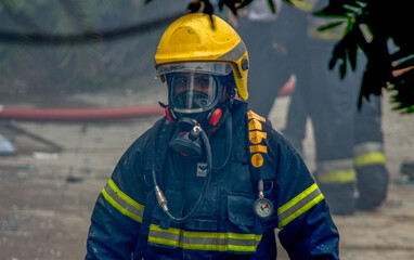 National Fire Fighter of Sri Lanka trying to fight a fire going on in a commercial store in...