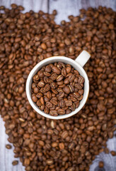Fototapeta premium coffee beans in a cup