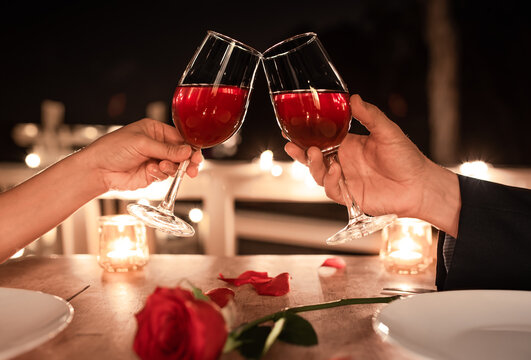 Romantic dinner date, couple drinking wine, Valentines day, anniversary concepts.	