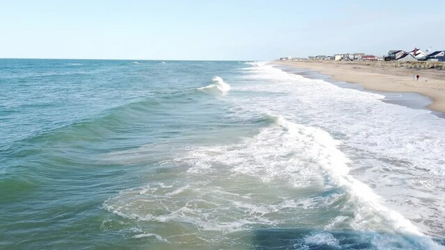 Waves Crashing On The Beach Shoreline