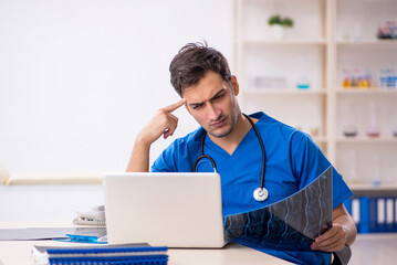 Young male doctor radiologist working in the clinic