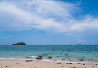 Landscape summer front view  tropical sea beach rock blue white sand background calm Nature ocean...