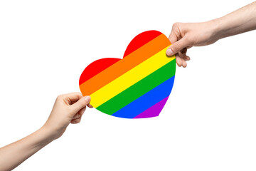 Rainbow colored cardboard heart in two hands.