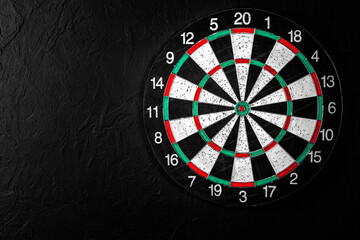 Dartboard on a black background.Darts game.Successful game.National English game.Target.