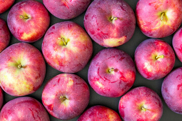 Fresh ripe red apples as black background