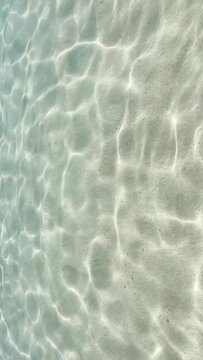 Gentle waves rippling over shallow sand