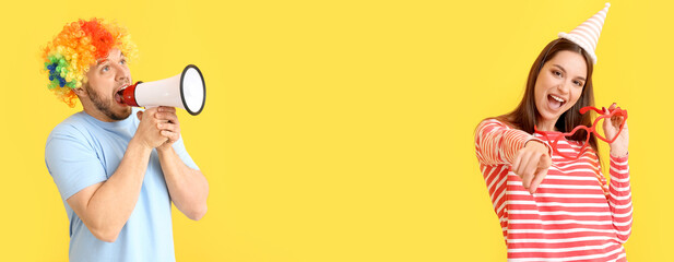 Funny man in wig and with megaphone on color background