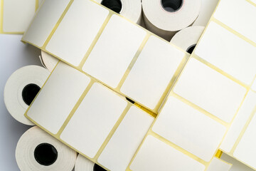 Rolls of white labels isolated. Labels for direct thermal or thermal transfer printing. Blank...