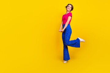 Fototapeta na wymiar Full length photo of cheerful adorable gorgeous lady wear bright clothes good mood empty space isolated on yellow color background