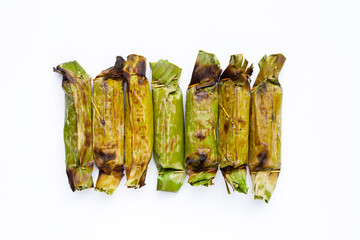 Grilled sticky rice in banana leaves with banana filling