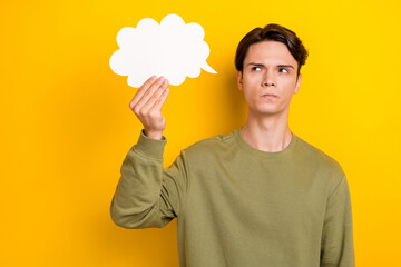 Portrait of minded creative person look hand hold empty space cloud card contemplate isolated on...