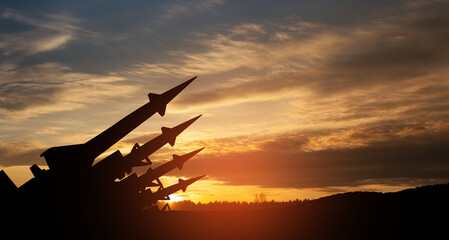 The missiles are aimed to the sky at sunset. Nuclear bomb, chemical weapons, missile defense, a...