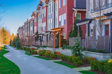 Modern residential houses neighborhood street in a suburban residential area. New and comfortable...