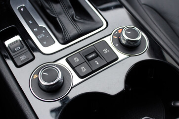 Control panel for off-road functions. 4WD switch. SUV driving mode switch, Modern car air suspension adjustment. Air suspension button. Detailing interior lux car.