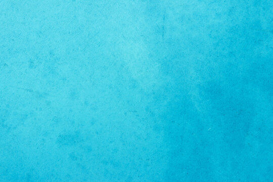 Blue light concrete texture for background in summer wallpaper. Cyan cement colour sand wall of tone vintage. Abstract teal dark color.
