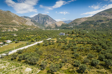 Fototapeta na wymiar Aerial view of village Borsh with mountains, Albania in Summer 2022