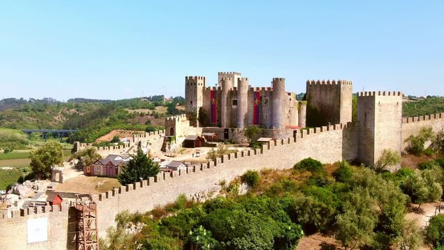 Aerial drone view of Castle of Obidos, famous medieval castle in Portugal. Summer in Europe travel, historic tourism destination.