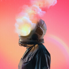 Astronaut with helmet smoking in profile with pastel colors with a small rainbow in the background, with gradient color in the background. Surreal image. Surrealism. © Danilo
