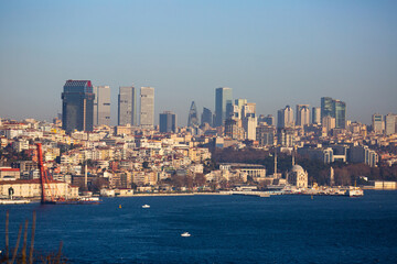 Scenic view of modern cityscape of Beyoglu district in Istanbul from Topkapi across Bosphorus and Golden Horn bay on sunny winter day, Turkey.