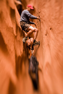 A man explores Blue John Canyon located in southeast Utah (Selective Focus).