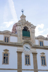 Fototapeta na wymiar Ancient clock tower with weather vane