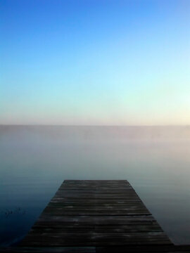 View of a pond on a misty morning.