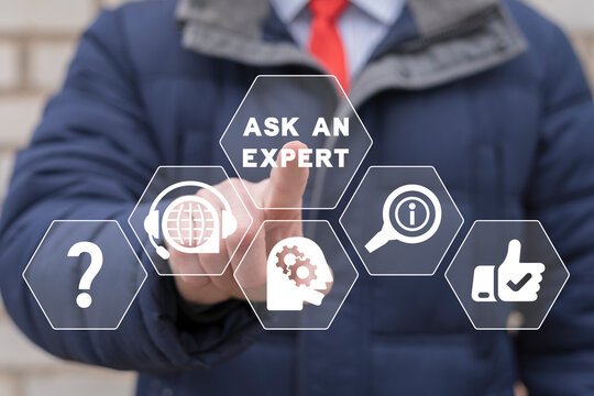 "Ask an expert" business concept. Businessman using virtual touchscreen presses inscription: ASK AN EXPERT. Expert Advice Consulting Help Support Service.