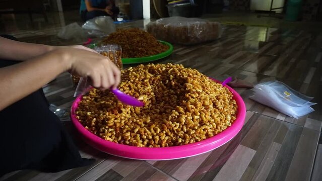 Stock footage of macaroni snacks being packed