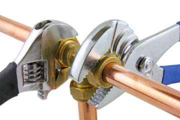 Wrenches adjusting a compression tee