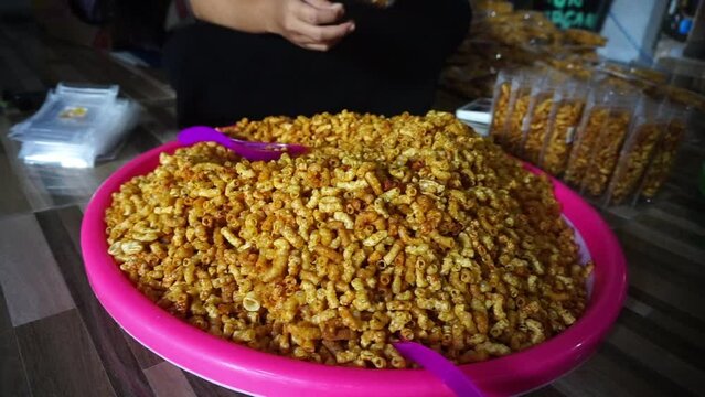 Stock footage of macaroni snacks being packed
