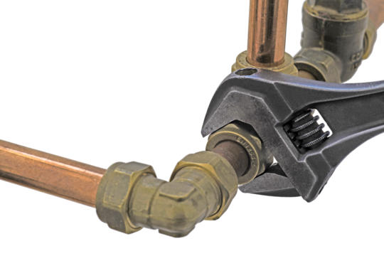 close up of a wrench being used to adjust a compression tee.