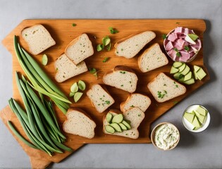 sliced ham, sausage and arugula, with cheese on wooden background, top view, copy space