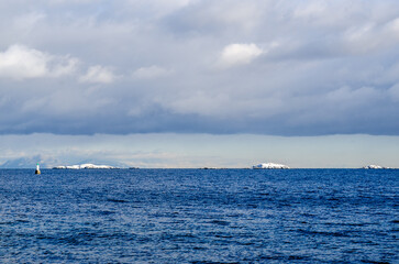 Fototapeta na wymiar Snow islands Small islands of the coast of Pipers Lagoon, look like icebergs after a snowy day