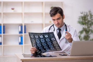 Young male doctor radiologist working in the clinic