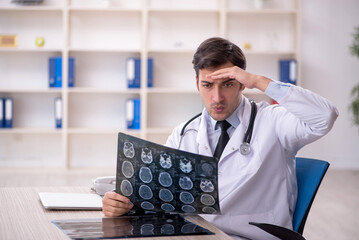 Young male doctor radiologist working in the clinic