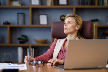 Depressed businesswoman overworked on laptop computer. Tired worker recieved bad online news....