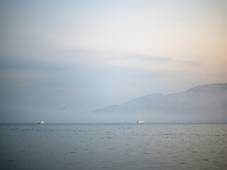 New Taipei City, Taiwan - JANUARY 14, 2023: Beautiful mist landscape of Tamsui on JANUARY 14,2023 in New Taipei City, Taiwan.It's popular sunset spot with visitors from Taipei.