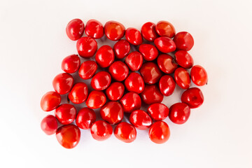 Ayurvedic plant Adenathera pavonina red seeds isolated on a white background